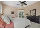 Bright bedroom with a sliding door to the lanai, soft hues, and ample closet space at 5510 Palm Aire Dr, Sarasota, FL 34243