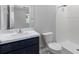 The bathroom offers a granite countertop, dark vanity, and a walk-in shower at 559 Spotted Slipper Pl, Ruskin, FL 33570
