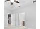 The bedroom features neutral walls and a ceiling fan, with entryways to a kitchen and bathroom at 559 Spotted Slipper Pl, Ruskin, FL 33570