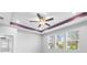 Bedroom ceiling with fan and windows facing outside at 559 Spotted Slipper Pl, Ruskin, FL 33570