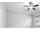 This is a bright room with a ceiling fan, and a window providing ample natural light at 559 Spotted Slipper Pl, Ruskin, FL 33570