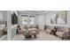 Cozy living room with neutral furniture, coffee table, television, and windows with blinds at 559 Spotted Slipper Pl, Ruskin, FL 33570