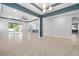 Open concept living room with tile floors and large windows offering plenty of natural light at 559 Spotted Slipper Pl, Ruskin, FL 33570