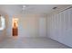 Cozy bedroom with lots of closet space, neutral walls and carpet, plus a doorway to the ensuite bathroom at 5621 Palm Aire Dr, Sarasota, FL 34243