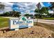 Community entrance sign for Palm Aire Country Club, showcasing a welcoming and established neighborhood at 5621 Palm Aire Dr, Sarasota, FL 34243