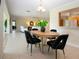 Open-concept layout with view of the kitchen and living room adjacent to the dining area at 5621 Palm Aire Dr, Sarasota, FL 34243