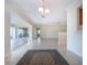 Bright entryway with tiled floors leads to a sunroom with sliding glass doors, enhancing the open feel at 5621 Palm Aire Dr, Sarasota, FL 34243