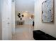 Inviting foyer with neutral tile flooring, decorative accents, and an open layout at 5621 Palm Aire Dr, Sarasota, FL 34243