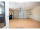 Spacious garage with automatic door and storage shelves at 5621 Palm Aire Dr, Sarasota, FL 34243
