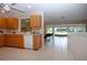 Eat-in kitchen boasts neutral countertops and an open view into a sunroom at 5621 Palm Aire Dr, Sarasota, FL 34243