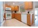 Spacious kitchen with wooden cabinets and stainless sink at 5621 Palm Aire Dr, Sarasota, FL 34243