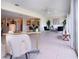 Open living space with views, seamlessly connecting indoor comfort with outdoor scenery to the dining area and kitchen at 5621 Palm Aire Dr, Sarasota, FL 34243