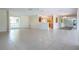 Open living room featuring a bright kitchen and tile floors at 5621 Palm Aire Dr, Sarasota, FL 34243