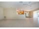 Spacious living room featuring an open-concept kitchen and tile floors at 5621 Palm Aire Dr, Sarasota, FL 34243