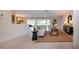 Inviting living room featuring tiled floors, comfortable seating, and seamless flow to the outdoor view at 5621 Palm Aire Dr, Sarasota, FL 34243