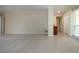 Spacious living room featuring neutral walls, tiled floor, and natural light at 5621 Palm Aire Dr, Sarasota, FL 34243
