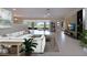 Open living room with tile floors, golf course view, with stylish furnishings and decor at 5621 Palm Aire Dr, Sarasota, FL 34243