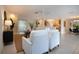 Open-concept living room with tile floors flows into the kitchen, creating a welcoming and functional space for modern living at 5621 Palm Aire Dr, Sarasota, FL 34243