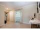 Bright and airy living room with neutral walls, tiled flooring, and natural light streaming through the window at 5621 Palm Aire Dr, Sarasota, FL 34243