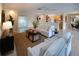 Spacious living room featuring tile floors, contemporary decor, and an open layout to the kitchen, ideal for Gathering gatherings at 5621 Palm Aire Dr, Sarasota, FL 34243