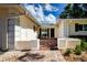 Charming brick patio featuring an outdoor seating area and access to the home at 5621 Palm Aire Dr, Sarasota, FL 34243