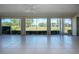 The sunroom has tiled floors, sliding glass doors with golf course view and lots of natural light at 5621 Palm Aire Dr, Sarasota, FL 34243