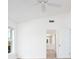 Bright bedroom showcasing a neutral color scheme, a window, and an en-suite bathroom at 5646 Country Lakes Dr, Sarasota, FL 34243