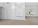 Bright foyer featuring double front doors with decorative glass, neutral walls, and tiled flooring at 5646 Country Lakes Dr, Sarasota, FL 34243