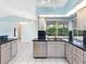 Bright kitchen features stainless steel appliances, granite countertops, and an eat-in kitchen with a big window at 5646 Country Lakes Dr, Sarasota, FL 34243