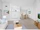 Bright living room with white walls, a dining table, and lots of natural light at 5646 Country Lakes Dr, Sarasota, FL 34243