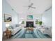 Stylish living room features a marble fireplace, modern furniture, and a calming color palette at 5646 Country Lakes Dr, Sarasota, FL 34243