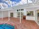 Screened patio and pool deck, including a poolside bar with granite countertops at 5646 Country Lakes Dr, Sarasota, FL 34243