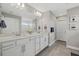 Bright bathroom featuring double sinks, quartz countertops, and updated fixtures at 5808 Silverside Pine Ct, Bradenton, FL 34211