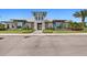 An eye-level shot of the community clubhouse's exterior shows immaculate landscaping and a contemporary facade at 5808 Silverside Pine Ct, Bradenton, FL 34211