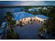 Luxury waterfront estate with a long private dock and large driveway at 612 Juan Anasco Dr, Longboat Key, FL 34228