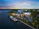 Waterfront home with a private boat dock and meticulously landscaped grounds at 612 Juan Anasco Dr, Longboat Key, FL 34228