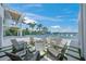 Backyard with a fire pit, lounge chairs, lush landscaping, and a refreshing pool at 612 Juan Anasco Dr, Longboat Key, FL 34228