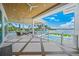 Spacious balcony with water views, comfortable seating, and a pristine pool at 612 Juan Anasco Dr, Longboat Key, FL 34228