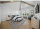Comfortable bedroom with vaulted ceiling, and elegant modern decor and furniture at 612 Juan Anasco Dr, Longboat Key, FL 34228