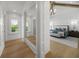 Bright bedroom featuring hardwood floors, windows with view and elegant, modern furniture at 612 Juan Anasco Dr, Longboat Key, FL 34228