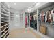 Spacious walk-in closet with custom shelving, drawers, and ample storage for shoes and clothing at 612 Juan Anasco Dr, Longboat Key, FL 34228