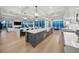 Bright, open kitchen boasts a large island, modern appliances, and views overlooking the water at 612 Juan Anasco Dr, Longboat Key, FL 34228