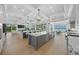 Spacious open-concept kitchen with a large island, modern appliances, and water views at 612 Juan Anasco Dr, Longboat Key, FL 34228