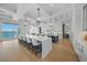 Spacious kitchen with an oversized island, modern appliances, and waterfront views at 612 Juan Anasco Dr, Longboat Key, FL 34228