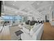 Open concept living room with coffered ceilings, modern decor, and bright, natural light at 612 Juan Anasco Dr, Longboat Key, FL 34228