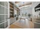 Bright and airy office space with a large desk, stylish built-ins, and ample seating at 612 Juan Anasco Dr, Longboat Key, FL 34228