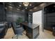 Sophisticated office features a large desk, black leather chair, and modern decor at 612 Juan Anasco Dr, Longboat Key, FL 34228