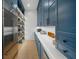 A large pantry is equipped with custom shelving and counter space, providing ample storage at 612 Juan Anasco Dr, Longboat Key, FL 34228