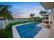 Inviting backyard featuring a stunning pool, lawn, and waterfront views at 612 Juan Anasco Dr, Longboat Key, FL 34228