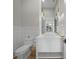 Chic powder room with modern fixtures, white vanity, and decorative lighting at 612 Juan Anasco Dr, Longboat Key, FL 34228